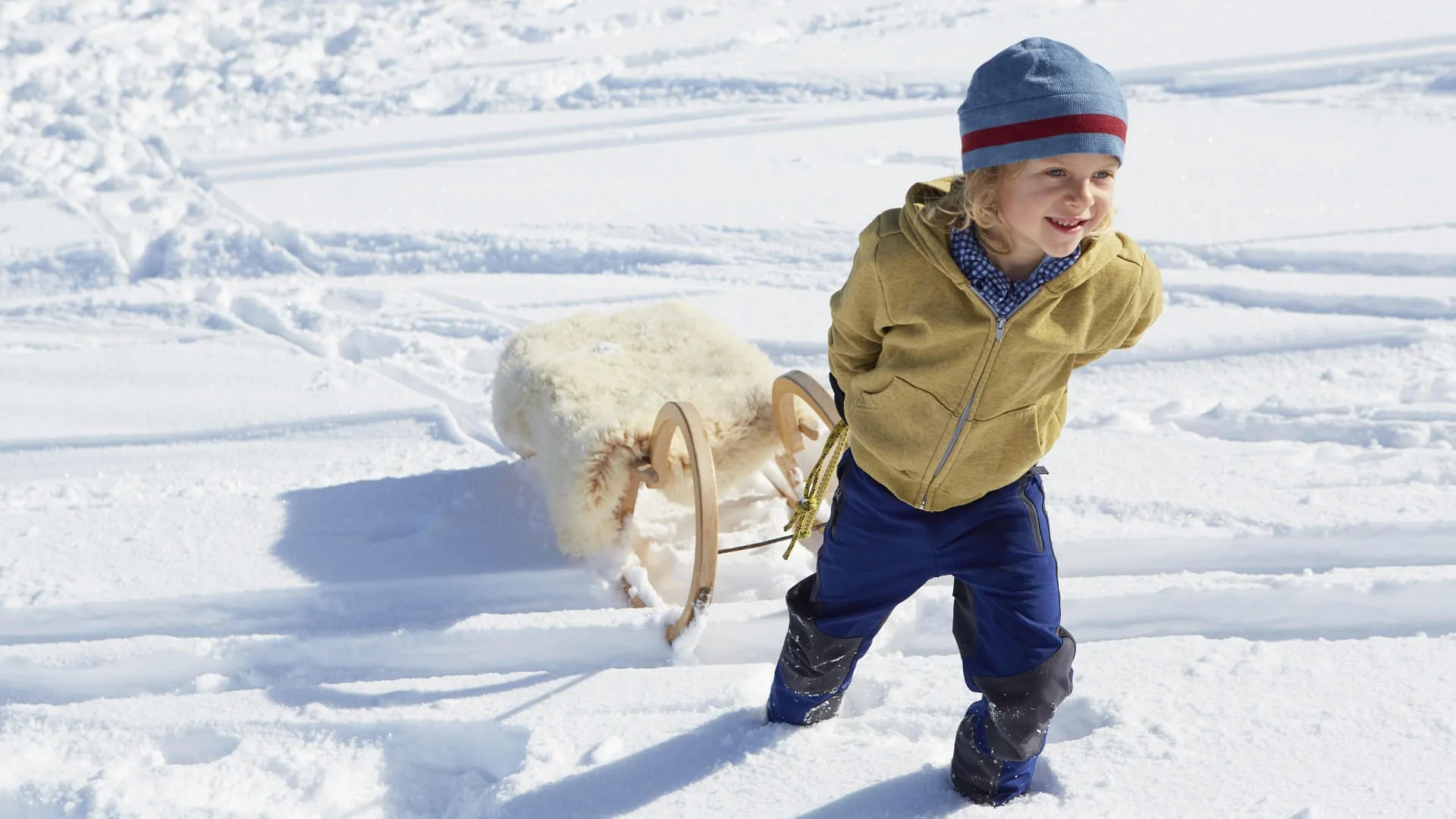 boy-pulling-toboggan-uphill-2023-11-27-04-49-29-utc