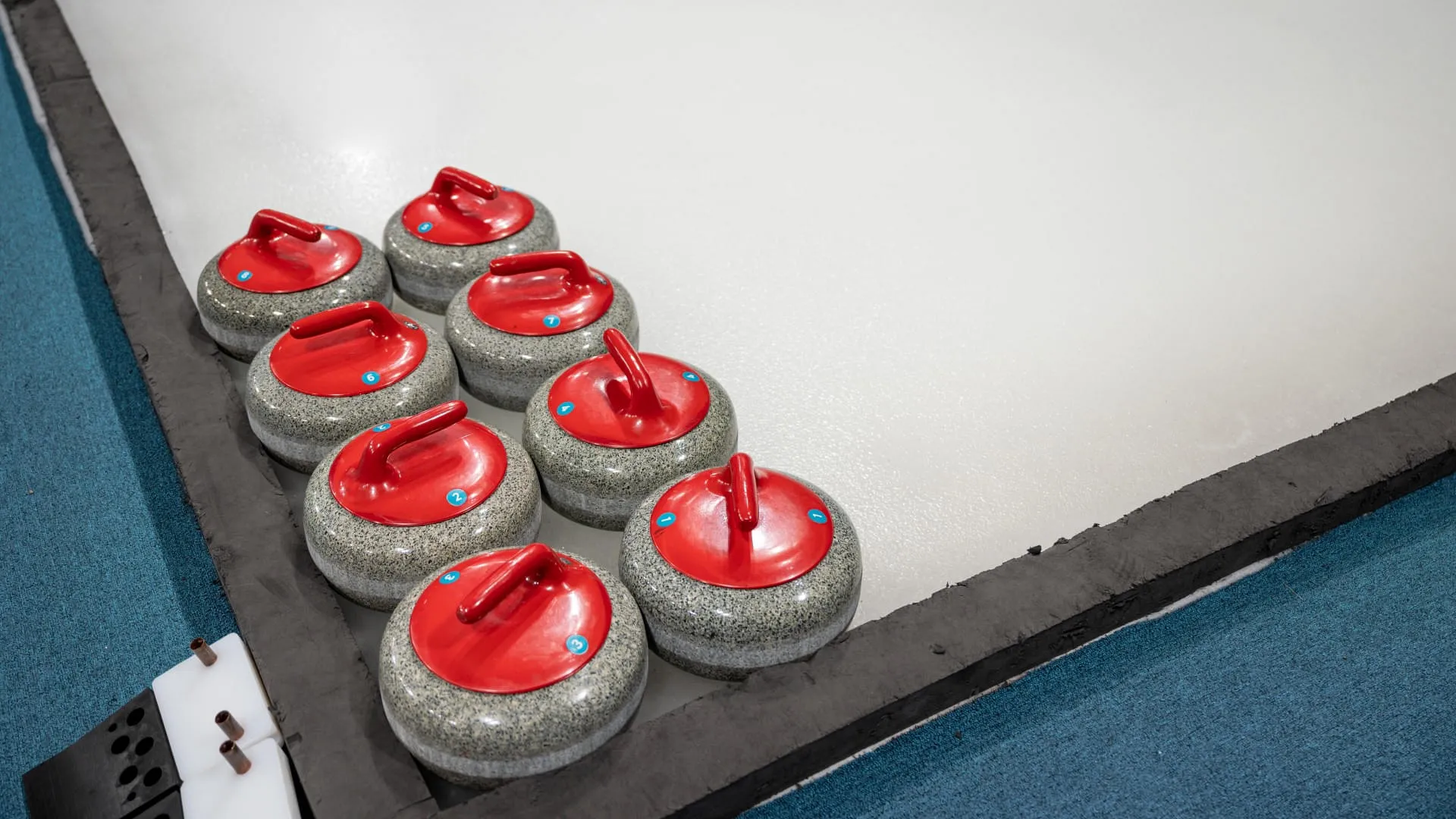 color-curling-stone-on-ice-court-in-curling-game-c-2023-12-15-00-01-30-utc